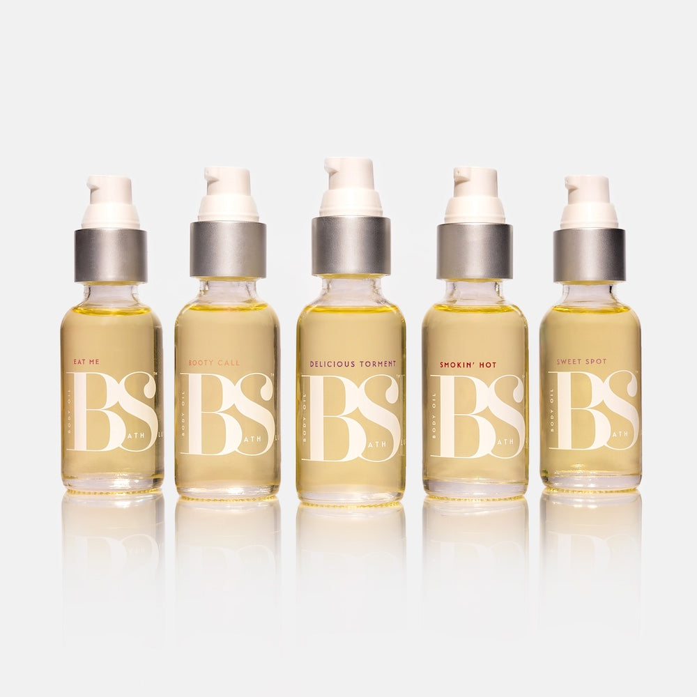 Bath Slut body oil gift set: five 1 oz glass pump bottles in Booty Call, Delicious Torment, Eat Me, Smokin' Hot and Sweet Spot